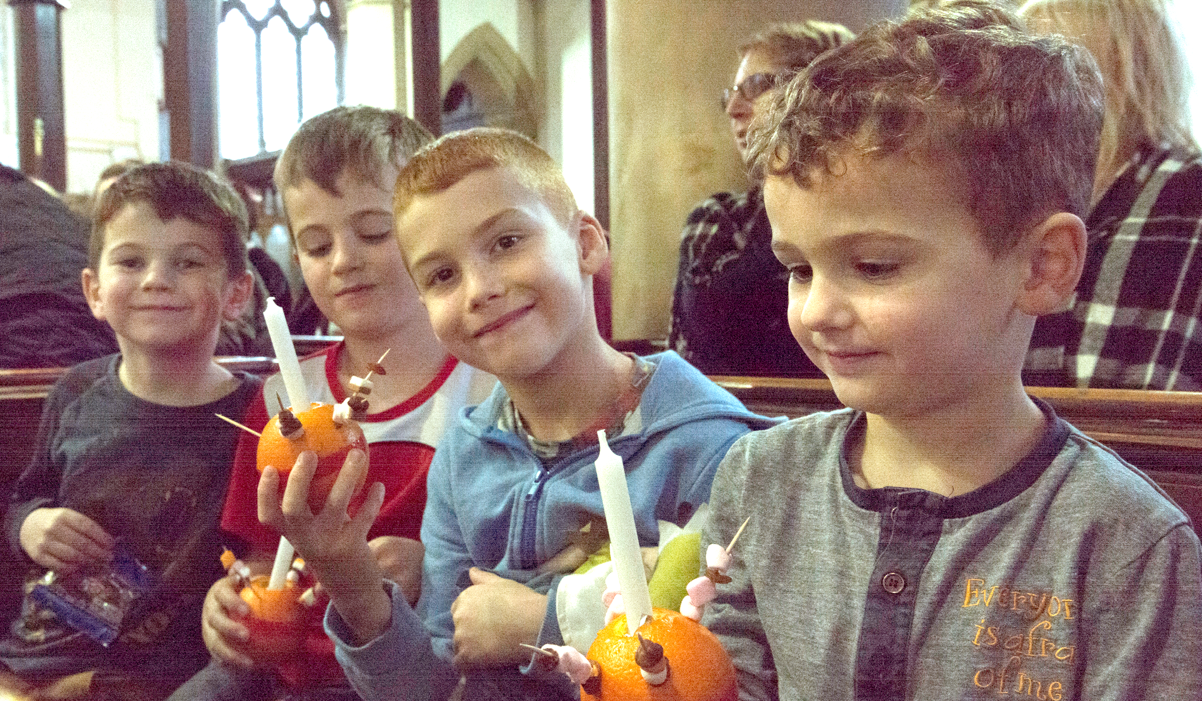 Children enjoying a Christingle service (Photo Credit: James Bremridge)